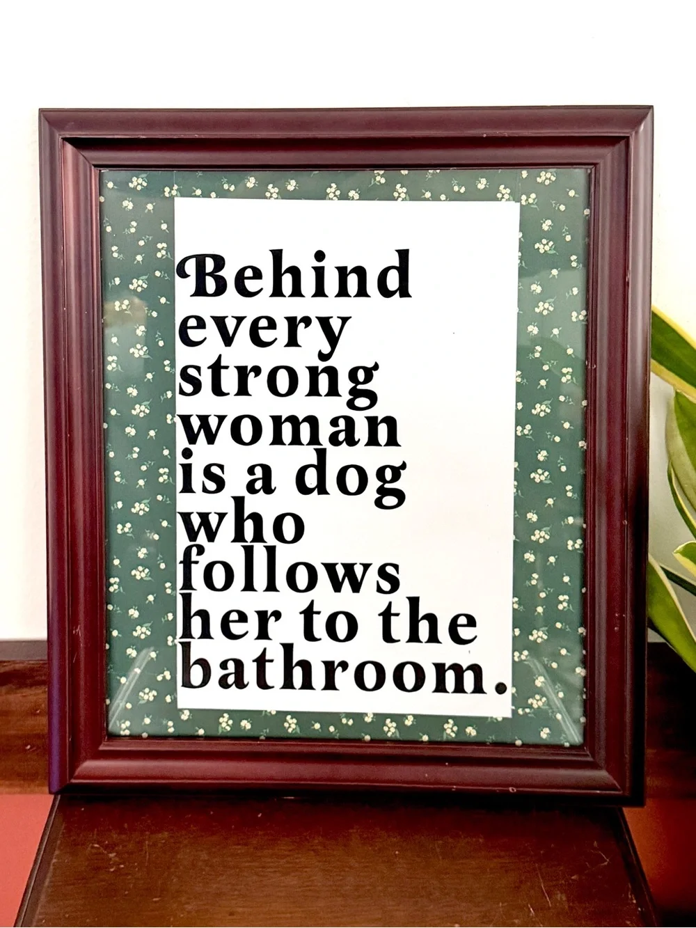 Behind Every Strong Woman is a Dog That Follows Her to the Bathroom Framed Art